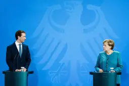 epa09438463 Austrian Chancellor Sebastian Kurz (L) and German Chancellor Angela Merkel look at each other during a joint press conference at the Chancellery in Berlin, Germany, 31 August 2021. German Chancellor Merkel and Austrian Chancellor Kurz met for bilateral talks.  EPA-EFE/CLEMENS BILAN