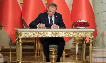 Poland's president swears in Donald Tusk's new government