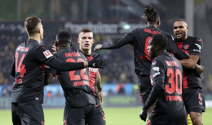 Stanisic keeps Leverkusen's unbeaten run alive in Dortmund draw