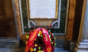 Siljanovska Davkova lays flowers at Macedonian-language memorial plaque in Rome