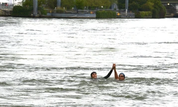 French sports minister swims in River Seine ahead of Paris Olympics