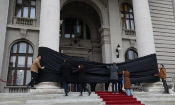 Silent protest in Serbia over station collapse that killed 14 people