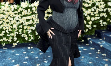 Rihanna debuts baby bump on star-studded Met Gala blue carpet