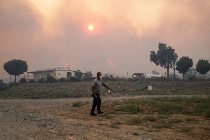 One dead, villages evacuated as wildfires rage in western Turkey
