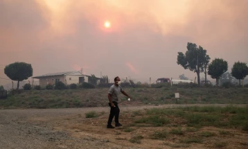 One dead, villages evacuated as wildfires rage in western Turkey